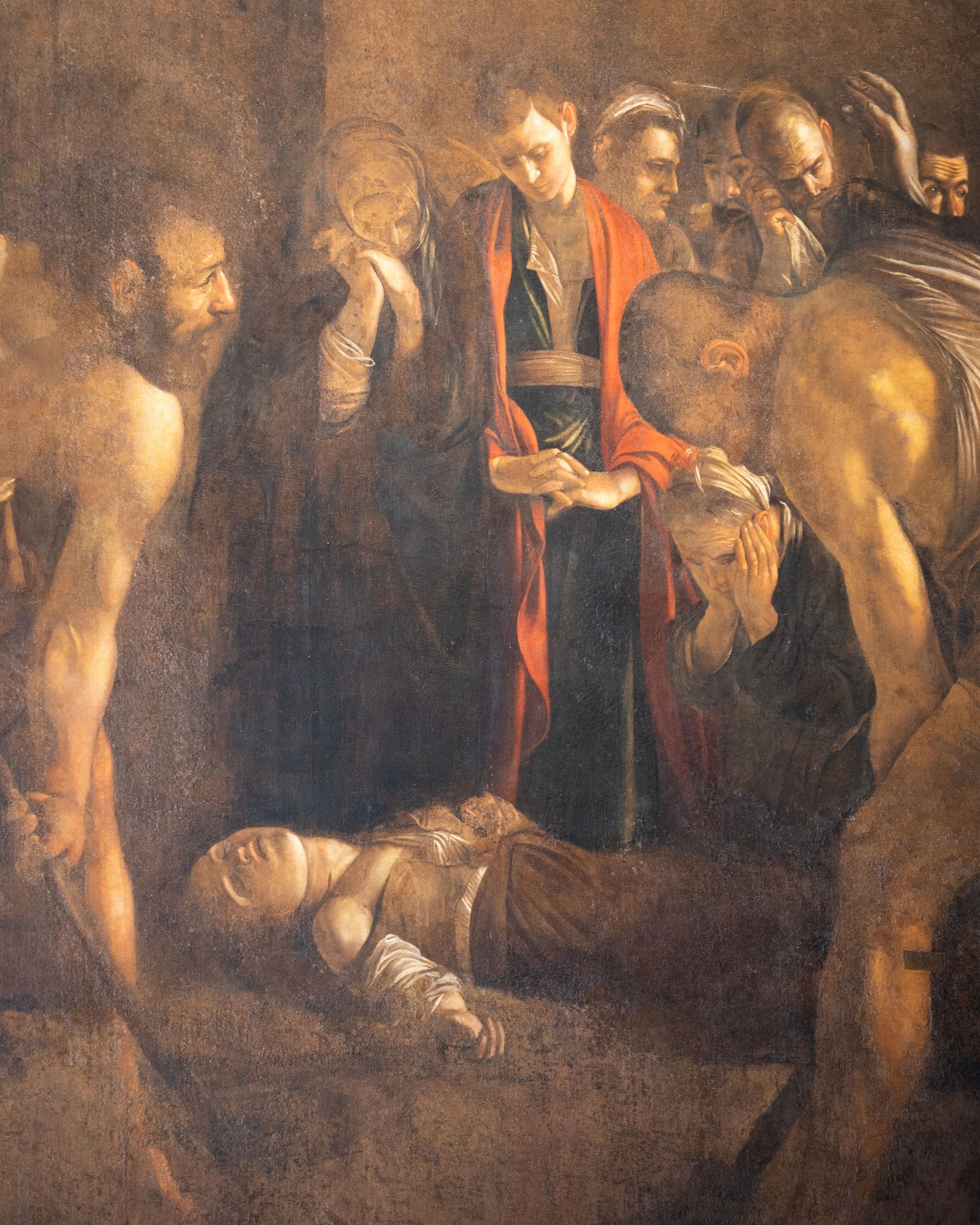 Caravaggio, Seppellimento di Santa Lucia (1608), dettaglio del corpo della santa. Siracusa, Santa Lucia al Sepolcro.