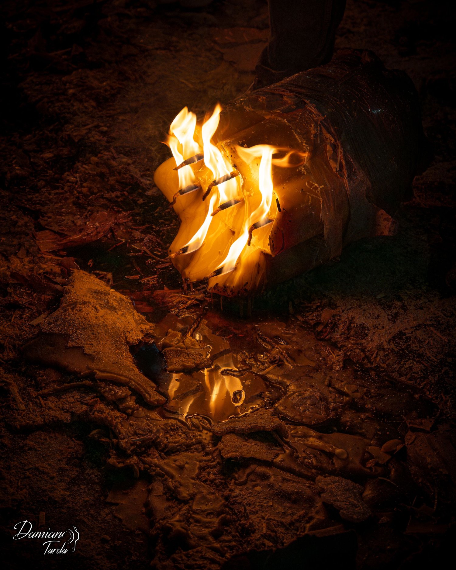 Candle for the Feast of Saint Agatha, symbolic photography, intimate and mysterious atmosphere.