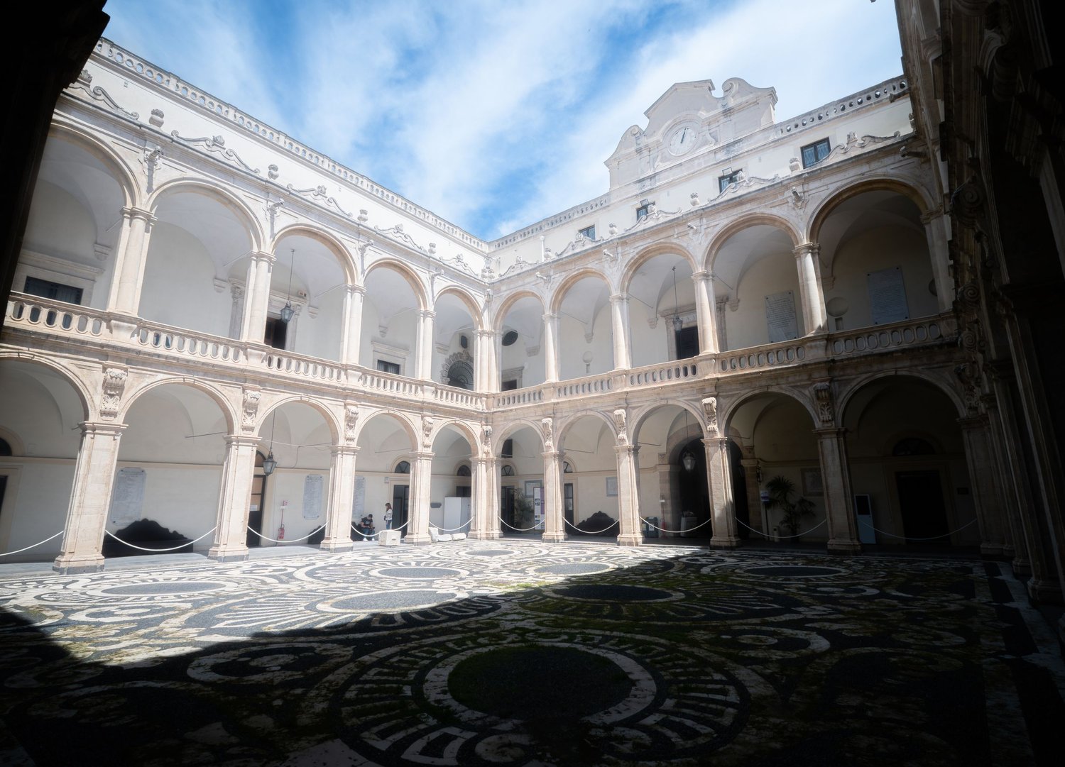 Baroque courtyard with arcades, Palazzo dell'Università, seat of the University of Catania. Perspective architectural photography