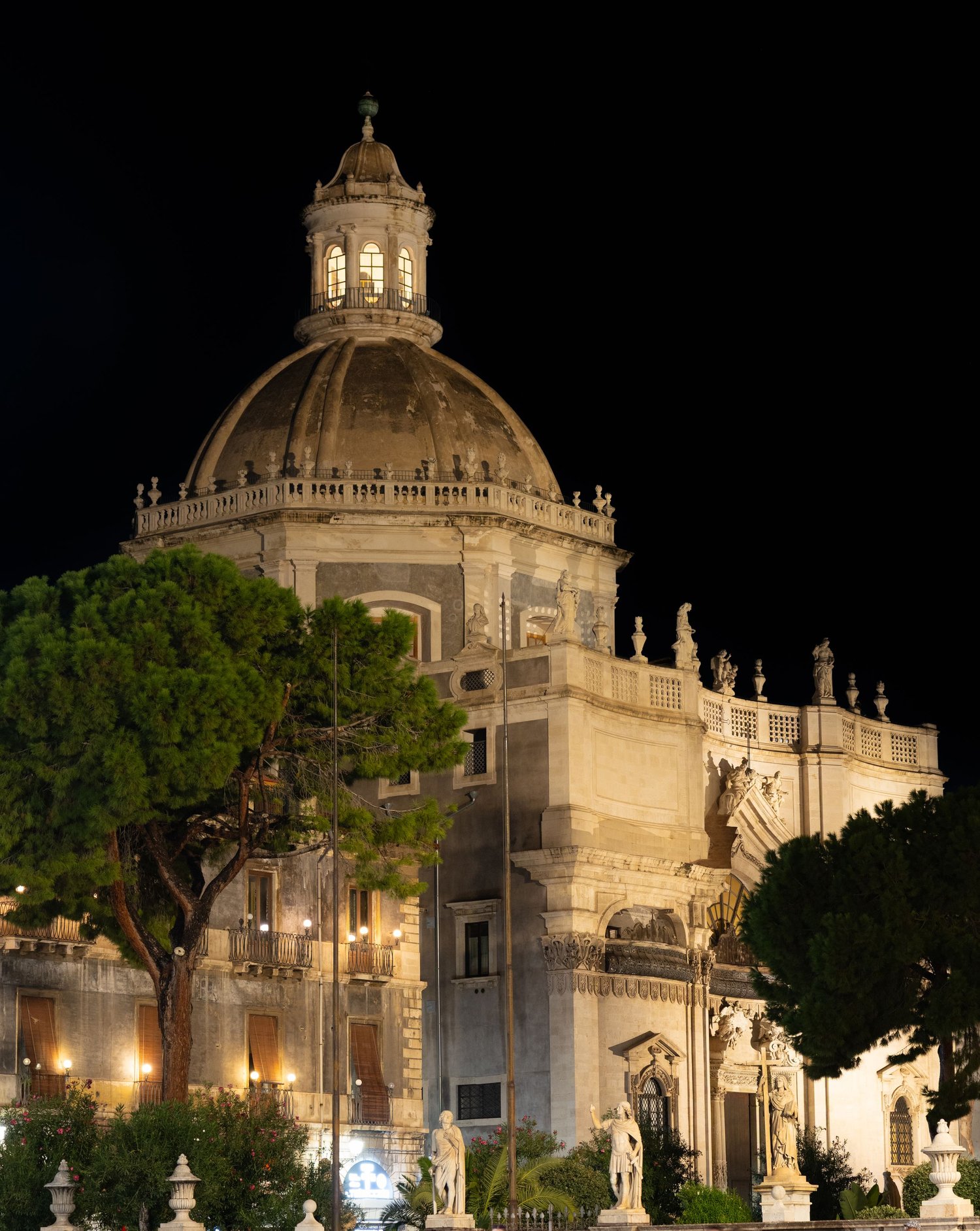 Dome of the Badia in Catania lit at night, artistic architectural photography.