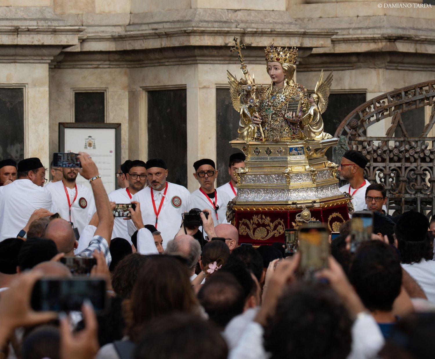 The bust of Saint Agatha in front of Catania Cathedral, among the faithful photographing it. 900th anniversary.