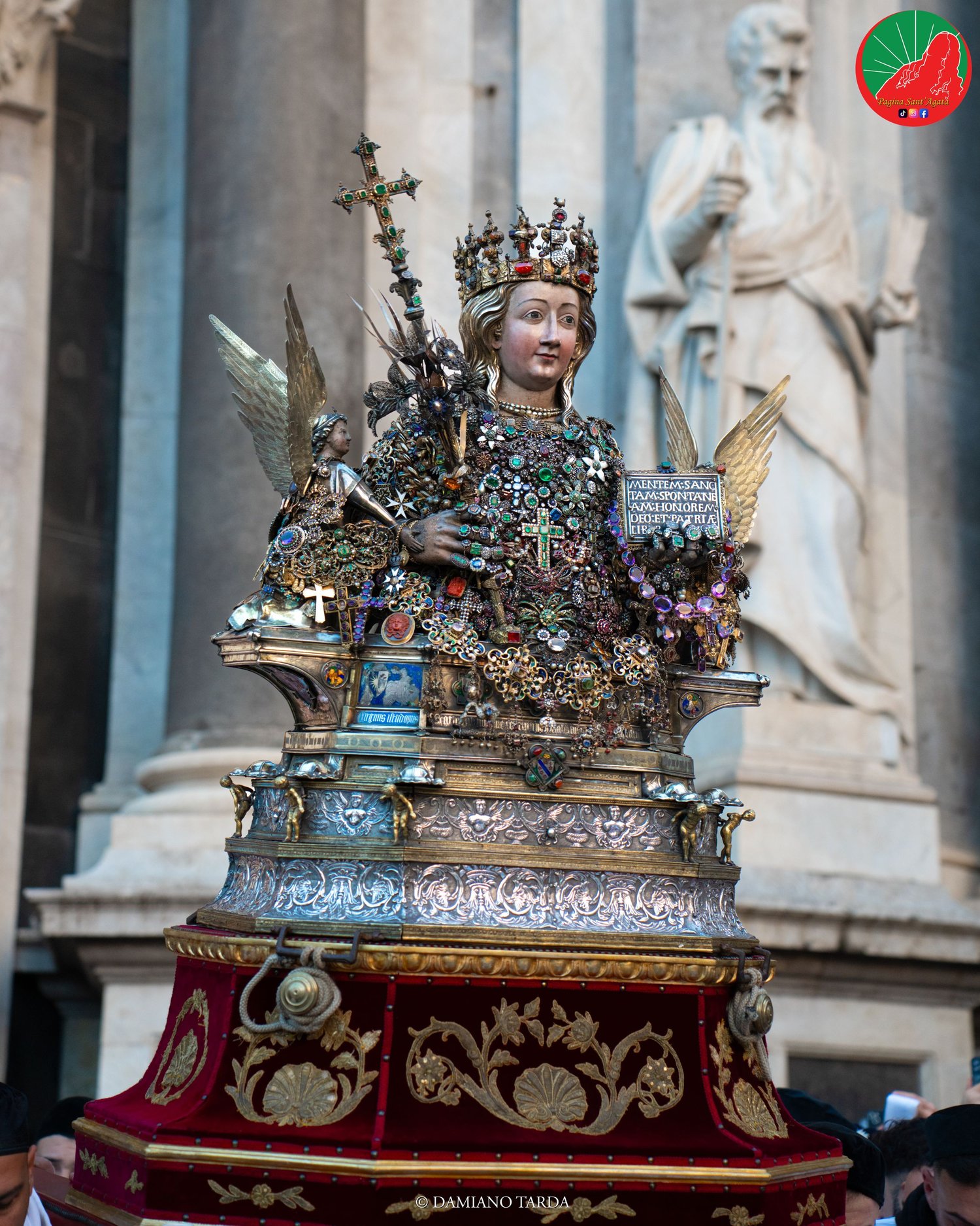 The bust of Saint Agatha on the threshold of Catania Cathedral, beside the statues of the portal.