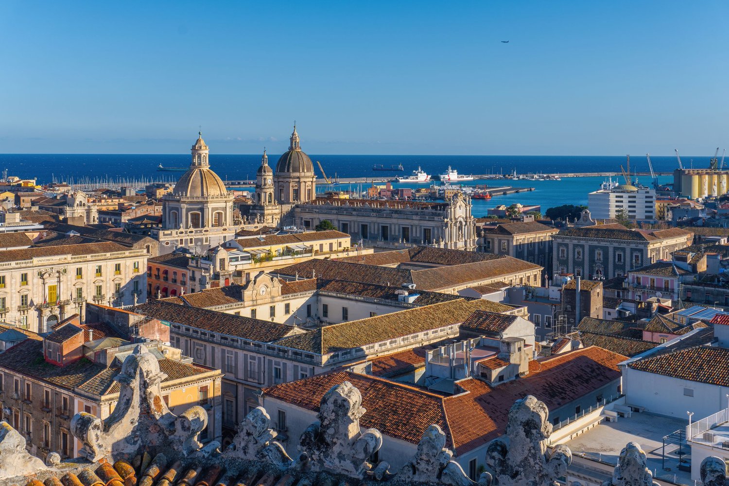 Panorama of Catania from the top of the Church of San Giuliano, with domes and rooftops, Mediterranean urban photography.