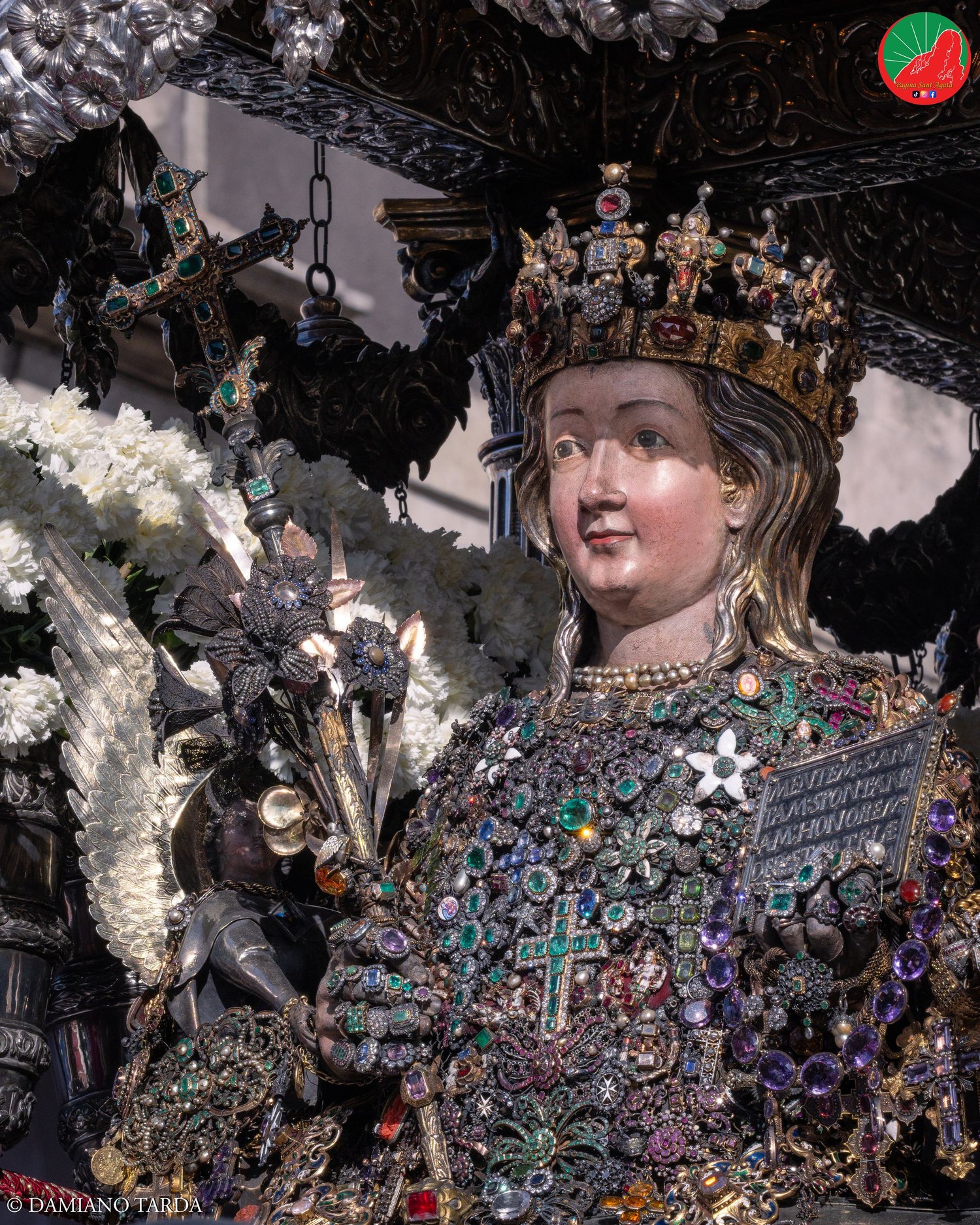 Close-up of the reliquary bust of Saint Agatha set with traditional jewels and precious ex-votos, Catania