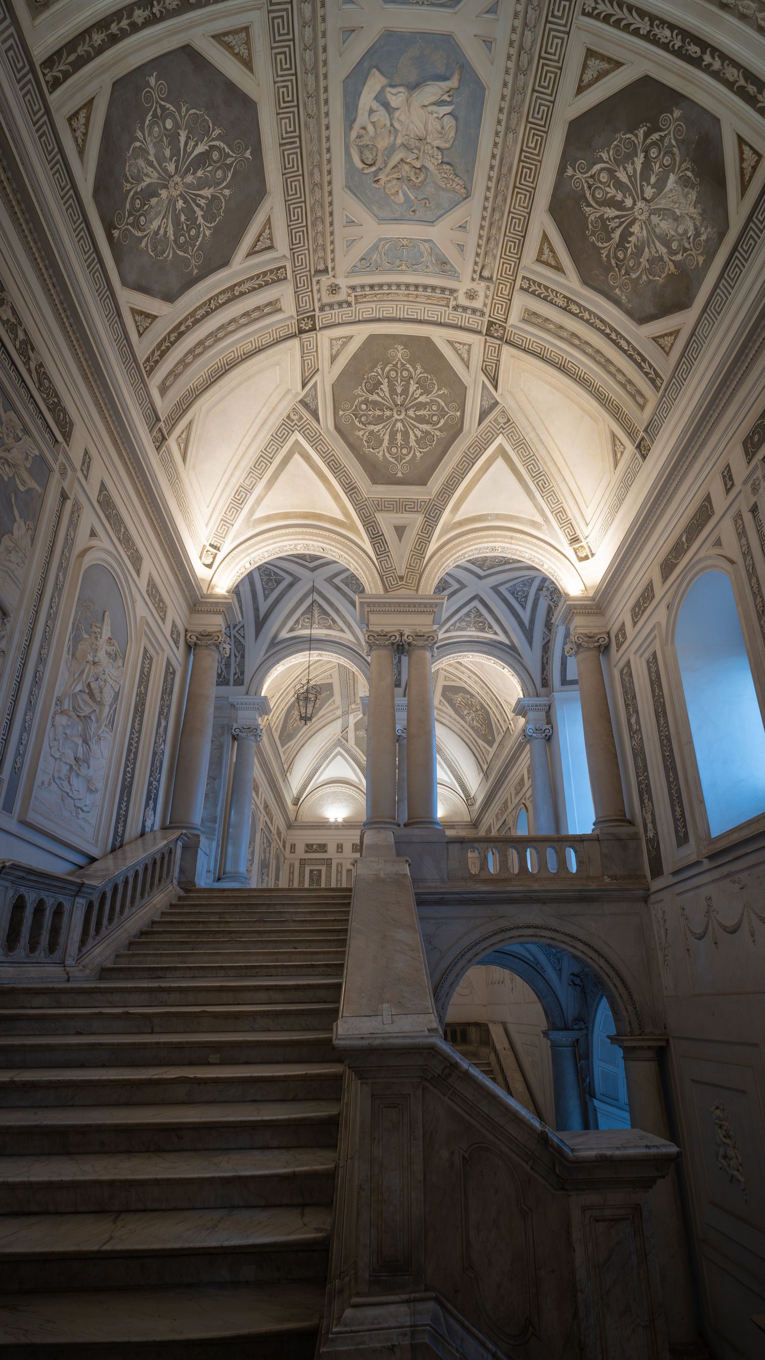 Illuminated Baroque staircase, Benedictine Monastery, Catania, interior of a historic building, architectural fine art photography.