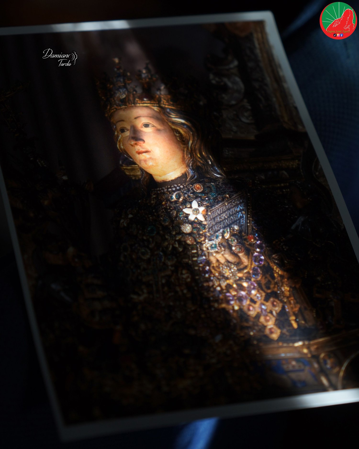 Photographic print of the reliquary bust of Saint Agatha in half-light.