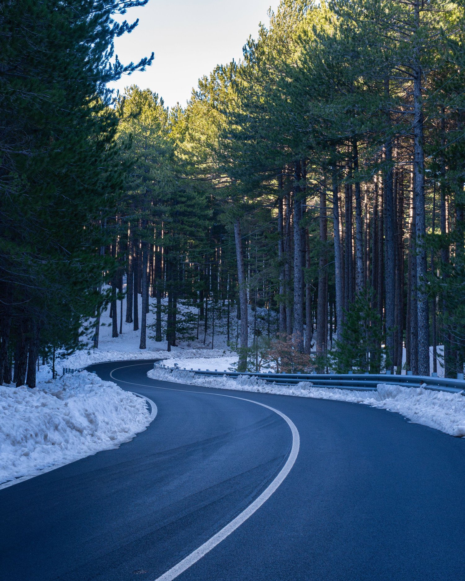 Snow-covered road on Etna, contemplative landscape and nature photography