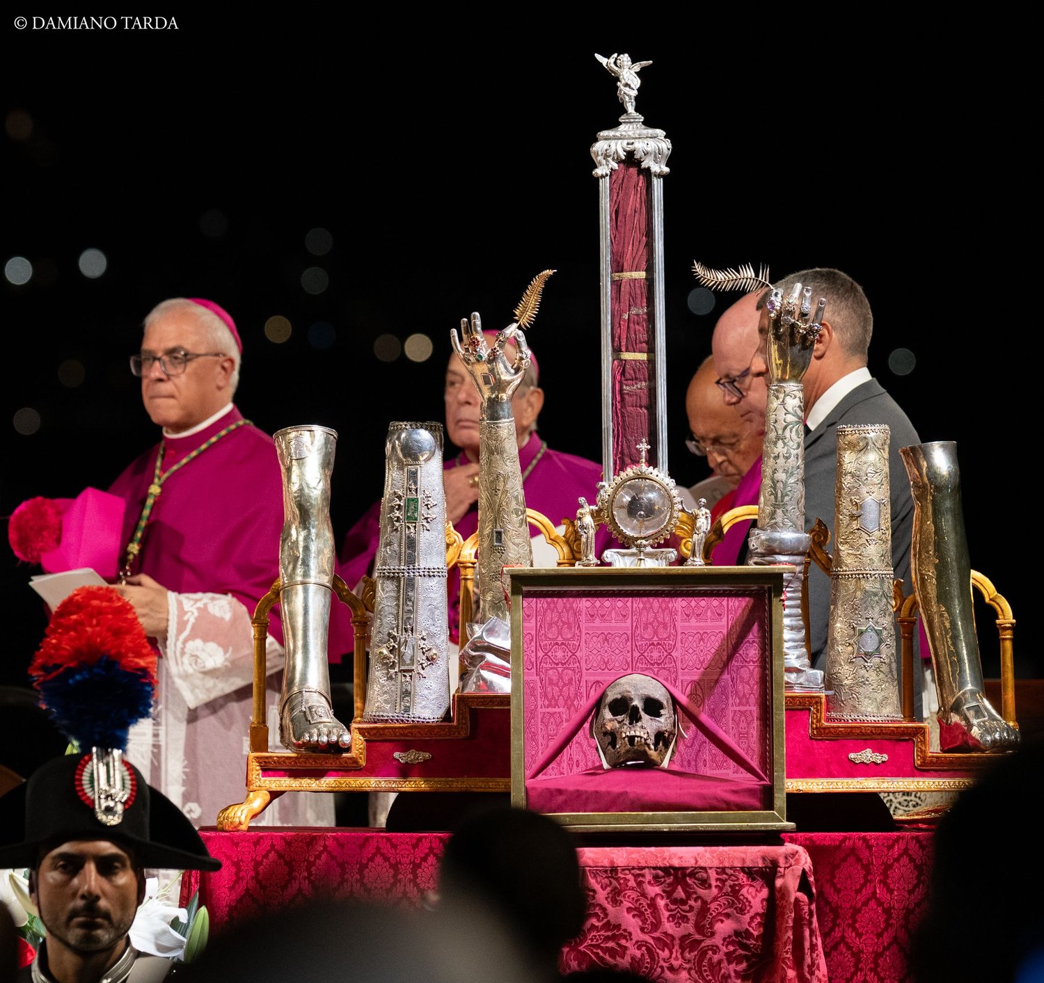 A bishop beside the reliquaries of Saint Agatha displayed on the altar during the night celebration.