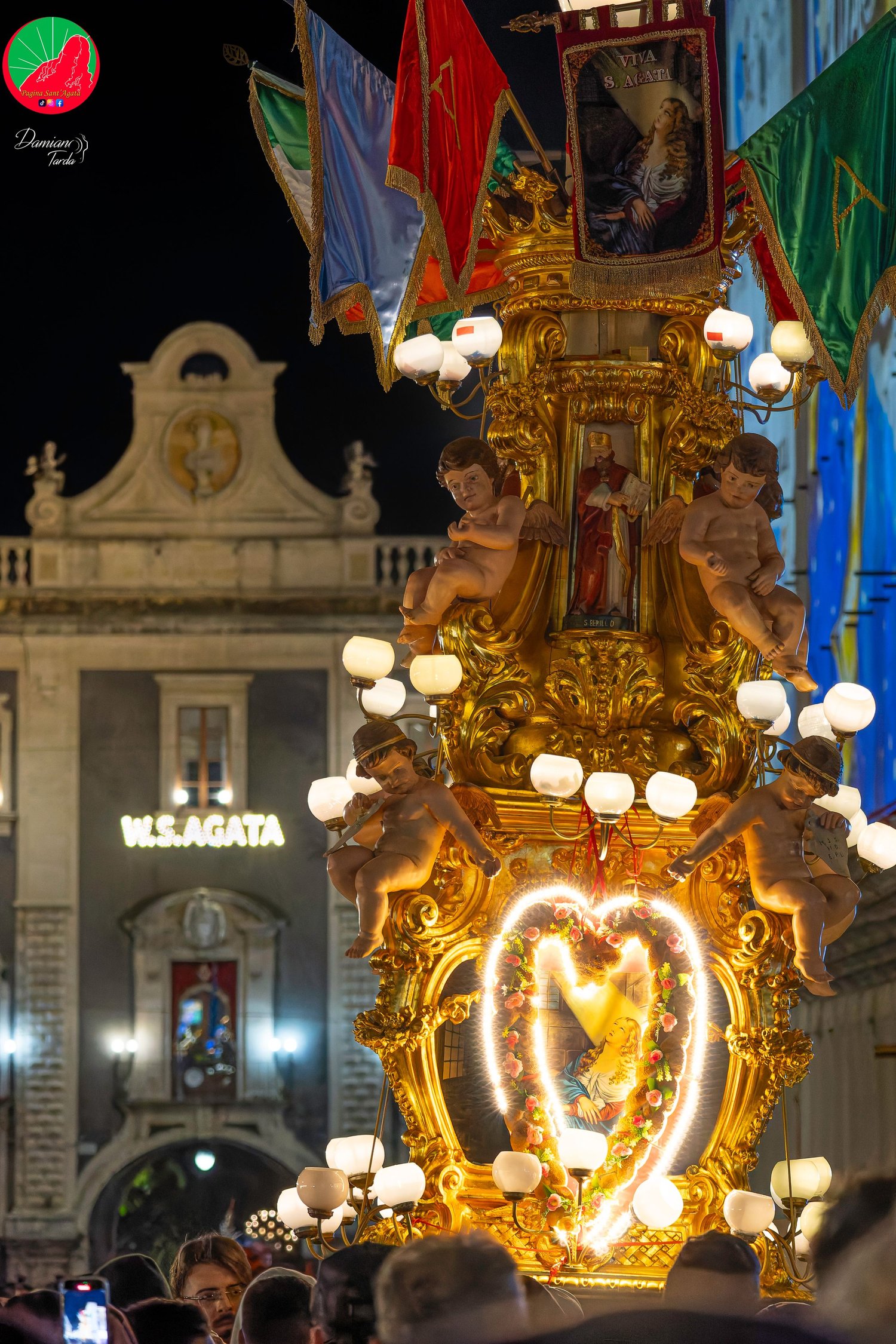 An illuminated candelora during the night procession of Saint Agatha in Catania.