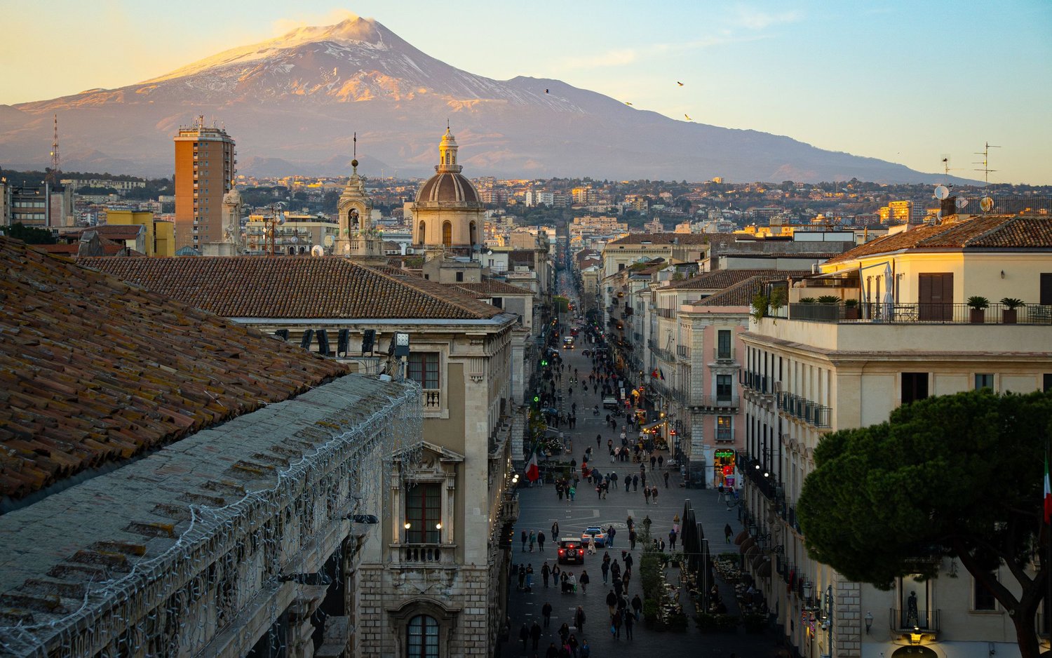 Panoramic view of Catania from the historic centre with Etna at sunset, Sicilian urban and landscape photography.